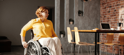 Woman in wheelchair in office
